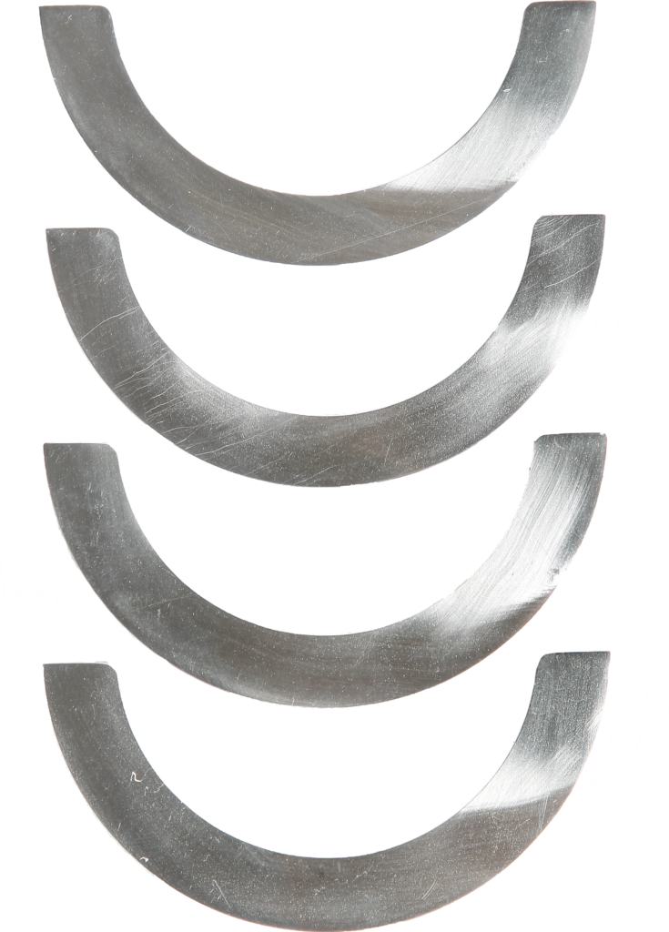 Four identical WT clamp metal semicircular components with flat ends and smooth, reflective surfaces are arranged vertically in a line on a white background.