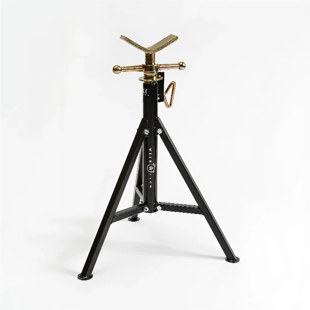 The WT Fix is a black and gold adjustable tripod pipe stand with a V-shaped support top, metal adjustment handles, and three foldable legs, shown against a plain white background.